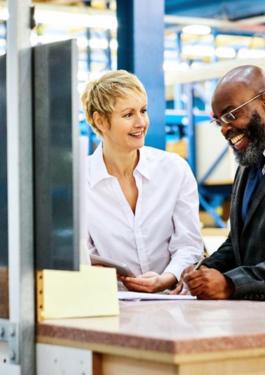 businessman and woman at warehouse